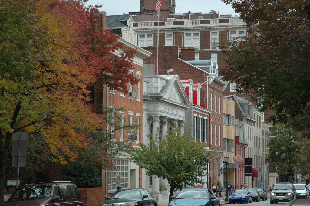 Old Buildings in a City with Cars on the Road