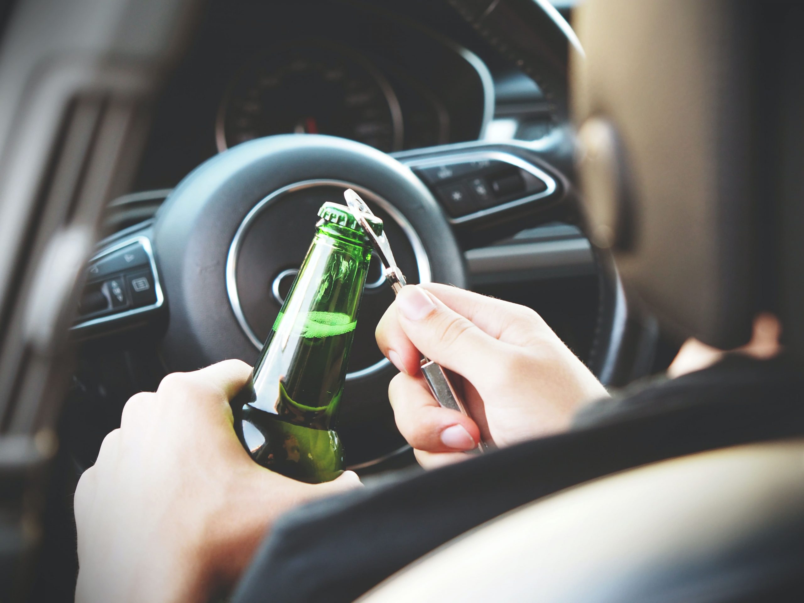 Person Opening Beer In Car
